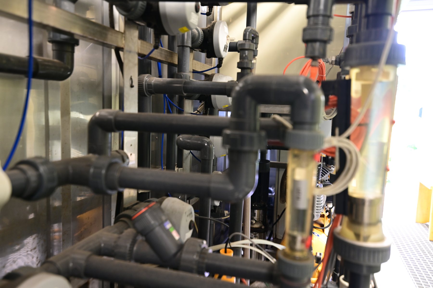 Valve and flow meter arrangement inside a modular treatment plant